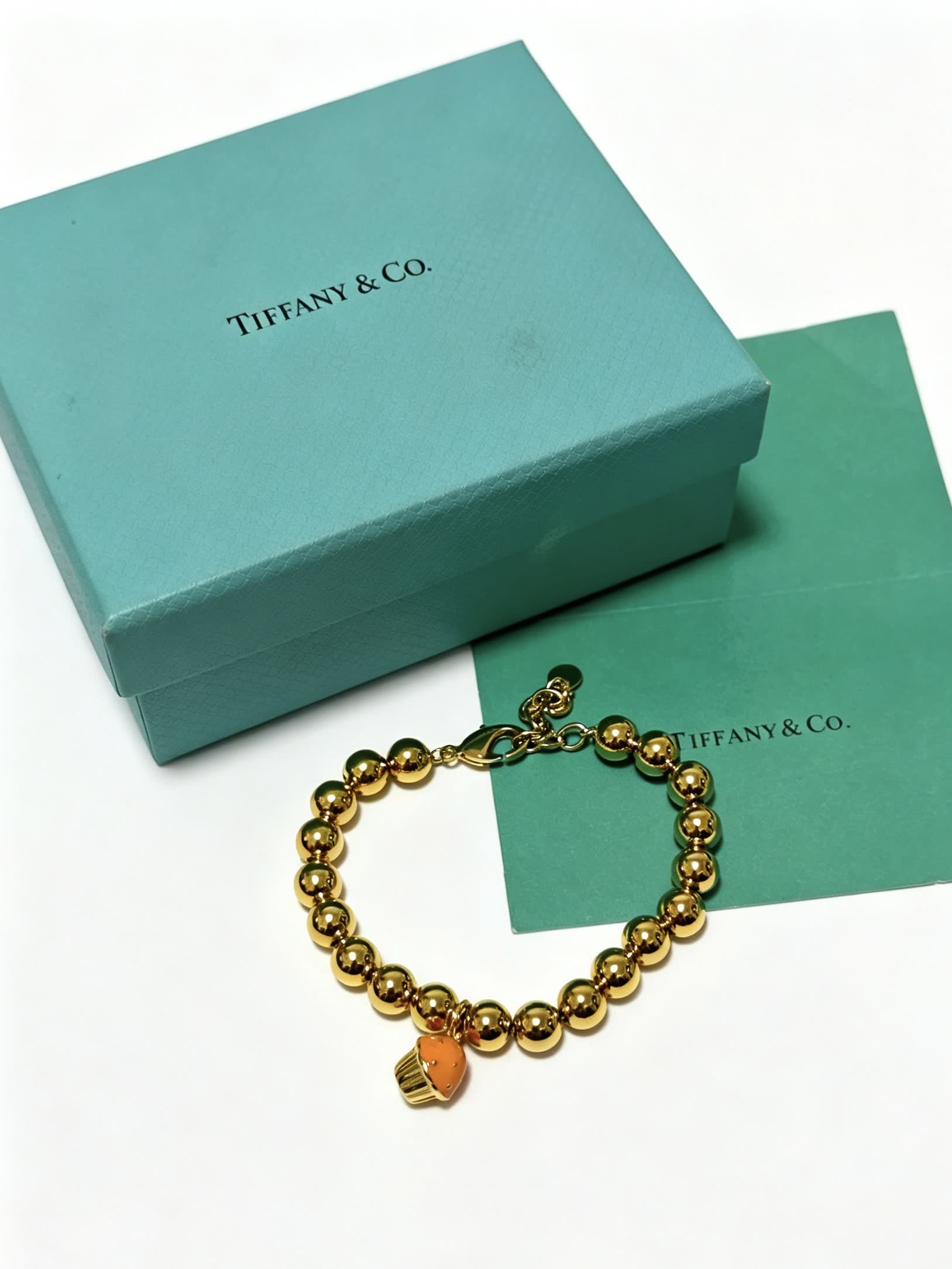 Tiffany & Co. Gold Bead Bracelet with Cupcake Charm
